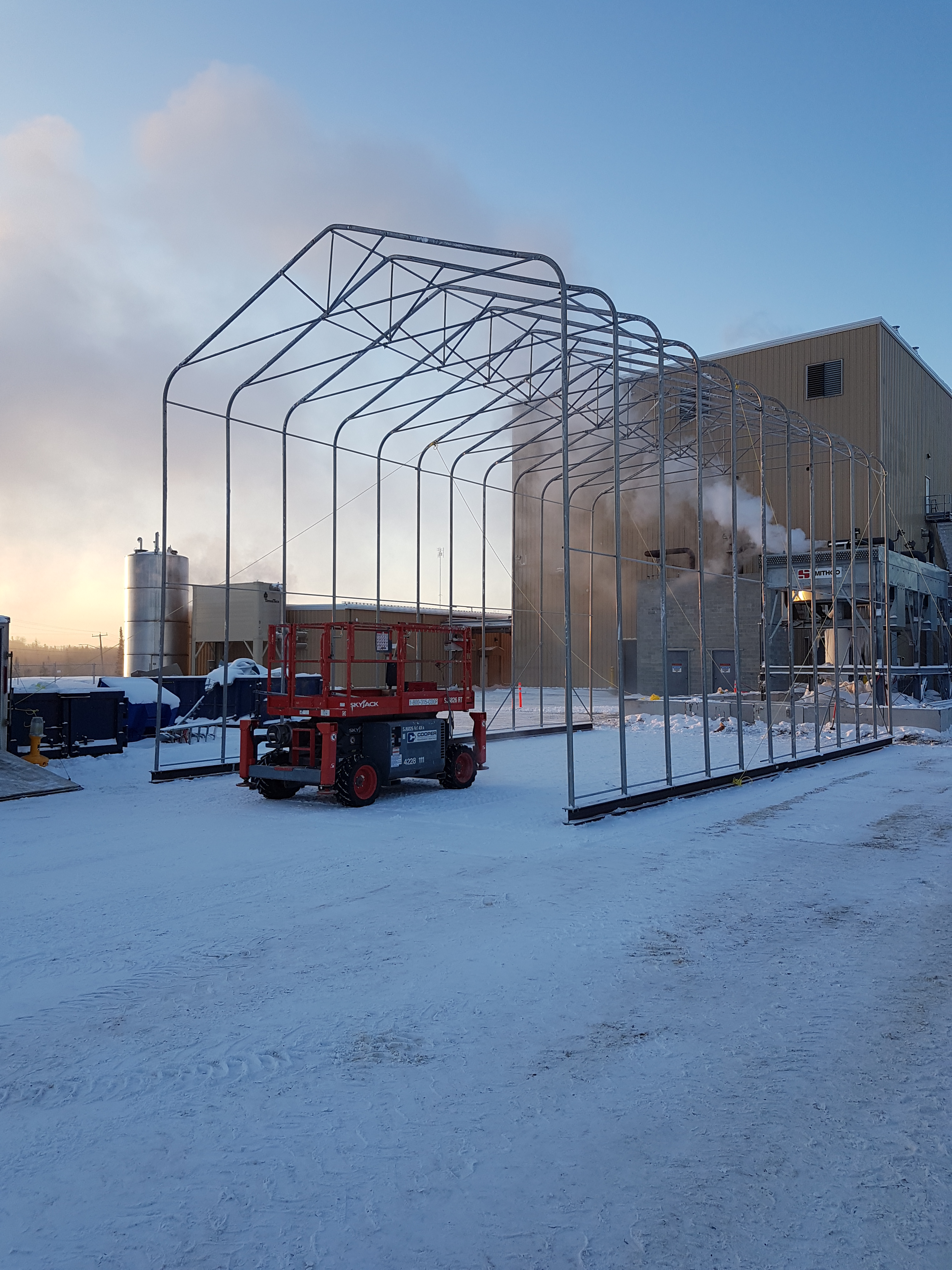 HARNOIS BUILDING OVER COOLING TOWER - Work Monster Inc.